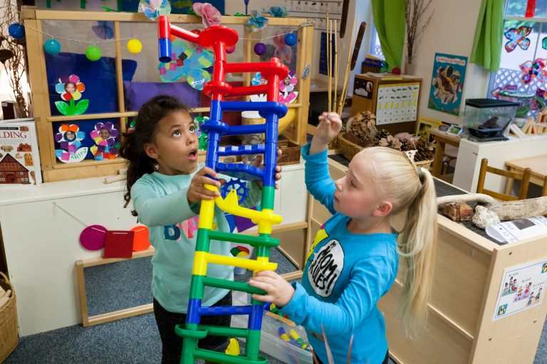 girls building a tower